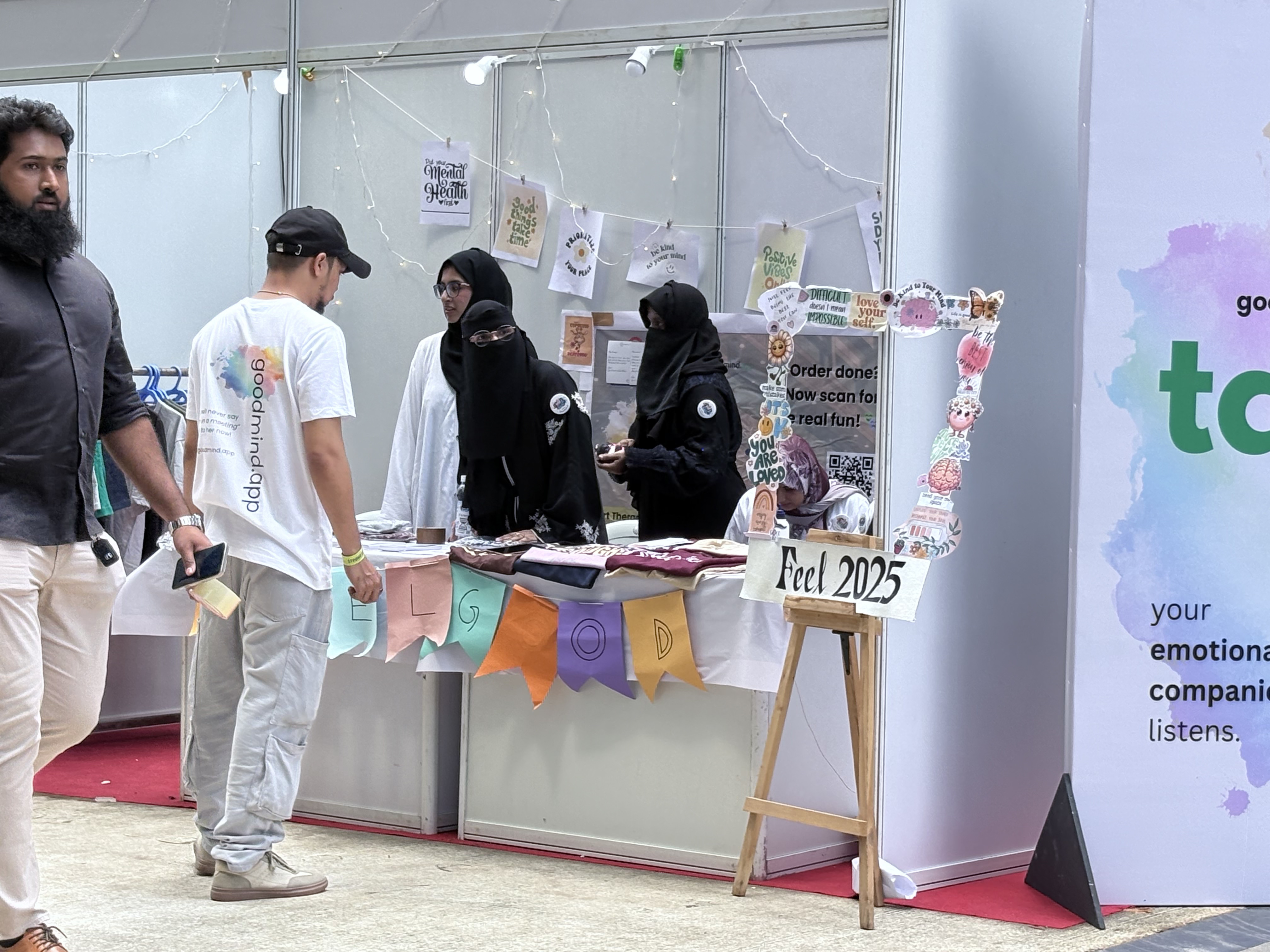 Visitors browsing a booth at a past FEEL event