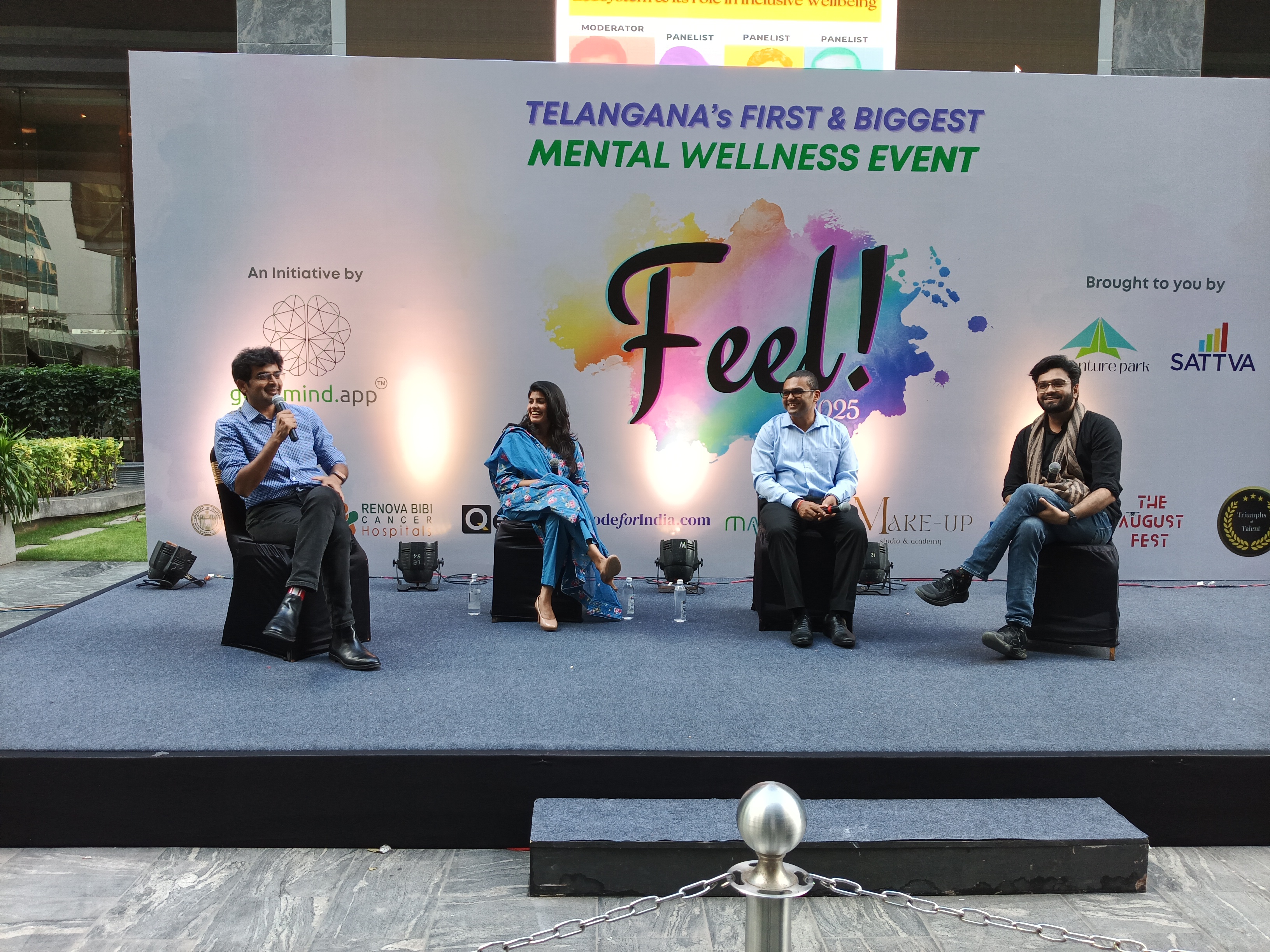 A panel discussion on stage at a past FEEL event